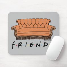 an orange couch with the word friend on it and a computer mouse next to it