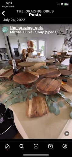 a table topped with lots of wooden plates