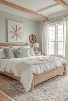 a large bed sitting in the middle of a bedroom next to a wooden ceiling fan