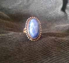 Art Deco 1920s Czech blue glass ring with a silver and brass band.  Material: Silver with antique brass and blue glass from Czechoslovakia 1920s Size: 3.5 Condition: Great for age. Royal Blue Gown, Floral Tea Dress, Art Deco 1920s, Brass Band, Glass Ring, Floral Tea, Glass Rings, Novelty Print, Vintage 1950s