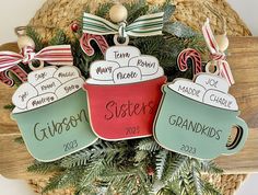 three personalized christmas ornament with coffee mugs and candy canes on them