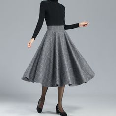 "DETAILS: * 30% wool, 30% fiber, 40% polyester * fully satiny liner * Two side pockets * back zip closure * pleated skirt, circle skirt * High waist skirt * below the knee skirt * Perfect for Winter, autumn * Lean More about the items From the FAQs on the page bottom * The model is 170 cm (5′ 7″) tall with a 80 cm (31.5\") bust, 66 cm (26\") waist. She is wearing the plaid wool skirt in size XS. CUSTOM MADE SERVICE If you * Change other color * Can't find your size in our size Chart * Change the Winter Wool A-line Skirt, Fitted A-line Skirt For Winter, Elegant Wool Full Skirt, Elegant A-line Bottoms For Winter, Winter Knee-length Lined Pleated Skirt, Gray Pleated Skirt For Fall, Gray Knee-length Formal Skirt, Elegant Flared Skirt Bottoms For Winter, Elegant Gray Skirt For Fall