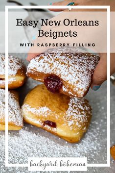 three pastries stacked on top of each other with powdered sugar and cranberry filling