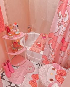 a bathroom with hello kitty decor and pink accessories