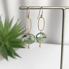 "Green Earrings, Dainty Earrings, Earrings for Women, Gold Earrings, Silver Earrings, Gift for Her, Gift for Mom, Gift for Wife, Birthday Gift These beautiful Faceted Oval Prehnite are suspended from a textured Oval Link. Each beautiful gemstone is hand wrapped in either 14K Gold Filled or Sterling SIlver Wire. Light enough for everyday, yet bold enough to take center stage for special occasions. Stones: Prehnite Material: 14K Gold Fill or Sterling Silver Length - Link: 1\" Length - Total: 1 1/2 Women Gold Earrings, Sage Green Wedding Theme, Gift For Wife Birthday, Green Themed Wedding, Sage Green Wedding, Wife Birthday, Earrings Dainty, Green Earrings, Gift For Wife