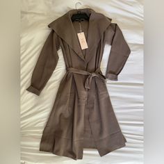 Nwt Long Taupe Cardigan With Oversized Collar Size Small, 100% Polyester. Never Been Worn, No Flaws Or Stains!! With Pockets! Features Oversized Collar For Expensive Look. Tie Belt Included. Adorable For Fall! #Longcardigan #Fallfashion #Boutiquefashion #Newwithtags #Mocha Beige Sweater Coat For Winter Daywear, Beige Long Sleeve Sweater Coat For Daywear, Spring Beige Cardigan With Shawl Collar, Beige Shawl Collar Cardigan For Spring, Fall Workwear Wrap Cardigan, Oversized Beige Cardigan For Work, Chic Taupe Cardigan For Fall, Fall Wrap Cardigan For Workwear, Chic Taupe Cardigan For Spring