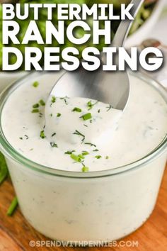 buttermilk ranch dressing in a glass bowl with a spoon sticking out of it