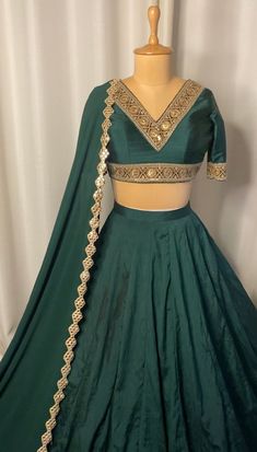 Emerald green lehenga set included dupatta, blouse and lehenga. Composition & Material: Georgette dupatta with raw silk lehenga and blouse in emerald green color. Sizing: Once your order is placed we will send you an email or WhatsApp regarding all the measurements that are required for your custom made outfit for the best fit. Delivery: This piece will take 4-6 weeks for production and delivery, time starts after we have received your sizing. If you require this earlier, please inquire prior to