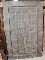 an old wooden door sitting on top of a floor