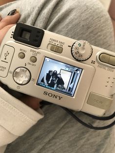 a person holding a camera in their hands