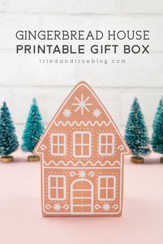 gingerbread house printable gift box with trees in the background