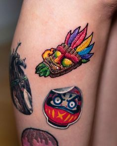 a close up of a person's leg with tattoos on it and various items