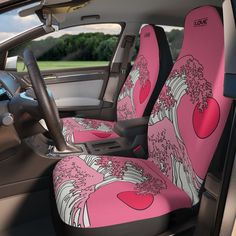 a pink car seat cover with an image of the great wave on it's side