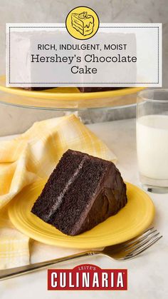 a piece of chocolate cake sitting on top of a yellow plate next to a glass of milk