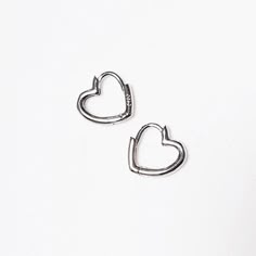 Heart Hoop Earrings, Heart Jewelry, Modern Earrings, Tiny huggies, Minimal Heart huggies, Boho Minimalist hoops, Gold hoop earrings, Silver heart hoopsYou can choose your desired finish - Silver, Rose gold / Gold coating.Size:* Length - 0.5" (1.4 cm).* Width - 0.55" (1.5 cm).* Item will arrive in a beautiful gift box with my brand logo, ready for gift giving.Materials:* Sterling silver / Rose gold coating / Gold coating.* Care instructions:My jewelry is made by me with great care and love.In ord Heart Huggies, Heart Earrings Silver, Bridal Earrings Studs, Silver Crystal Earrings, Crystal Wedding Jewelry, Hoop Earrings Silver, Silver Heart Earrings, Hoops Gold