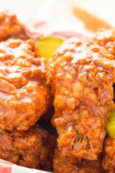 Two breaded chicken wings coated in a red Nashville Hot sauce. Pickles and white bread are out of focus in the background. Nashville Hot Chicken Wings, Hot Chicken Wings Recipe, Breaded Wings, Easy Main Course Recipes, Deep Fried Chicken Wings, Hot Chicken Wings, Wings Game, Recipe Using Chicken, Nashville Hot Chicken