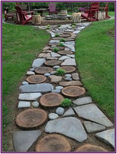 a stone path made out of logs with chairs in the background