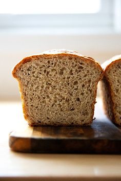 two slices of bread sitting on top of a cutting board