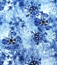 an abstract blue and white tie dye background with black circles in the center, surrounded by smaller flowers