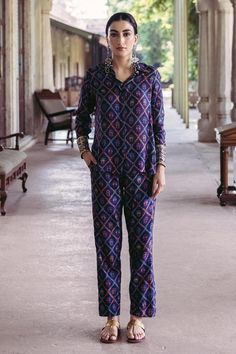 Midnight blue shirt with floral print and embroidered cuffs. Paired with printed trousers.   
Components: 2
Pattern: Printed, Embroidered, Woven
Type Of Work: Floral
Neckline: Shirt collar
Sleeve Type: Full
Fabric: Dupion Silk, Lining: Crepe
Color: Blue
Other Details: 
Button placket
Length:
Shirt: 26  inches
Pant: 38 inches                                                                                     
Sleeve: 22 inches
Occasion: Wedding - Aza Fashions Blue Long Sleeve Pant Set For Work, Long Sleeve Printed Sets For Workwear, Workwear Sets With Printed Motifs And Straight Kurta, Straight Kurta Sets With Printed Motifs For Work, Traditional Sets With Set-in Sleeves And Straight Pants, Festive Pant Set With Printed Motifs And Straight Pants, Festive Pant Set With Printed Motifs, Festive Cotton Set With Straight Pants, Traditional Workwear Sets With Printed Motifs