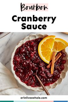 cranberry sauce in a bowl with cinnamon sticks and an orange slice on top