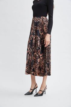 Our effortless Pleated Midi Dress has a distinct modern vibe. The crew neck viscose knit bodice combines with a graphic paisley print pleated skirt. Definitely poetry in motion! Mixed Media Printed Pleated Midi Dress with Ribbed Knit Mock Neck Bodice Bodice: 49% Spandex, 32% Viscose, 17% Nylon Skirt: 98% Polyester, 2% Spandex Model is 5'9" and wearing size S Measurements: 51 "L (shoulder to hem) Imported Dry Clean Style #: ETR44223 Maxi Design, Printed Pleated Skirt, Elie Tahari, Pleated Midi Dress, Nordstrom Dresses, Paisley Print, Pleated Skirt, Dress Accessories, Ribbed Knit