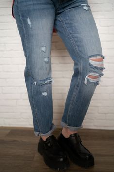 The ultimate jeans for spring! Mid rise classic Boyfriend style 100% cotton Distressing around knees Open side seam Double fold hem Model is 5'0" and wearing a size. The length measures 37" and the inseam measures 28". Fall Distressed Rigid Denim Jeans, Cutoff Denim Jeans For Fall, Ripped Rigid Denim Cropped Jeans For Fall, Fall Cutoff Denim Jeans, Fall Denim Blue Cutoff Jeans, Everyday Distressed Cropped Bottoms, Fall Ripped Cropped Jeans In Rigid Denim, Everyday Distressed Cropped Leg Bottoms, Fall Distressed Medium Wash Cropped Jeans