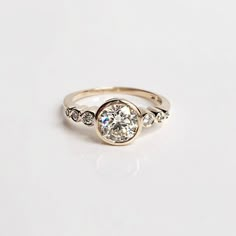 a diamond ring with three stones on it