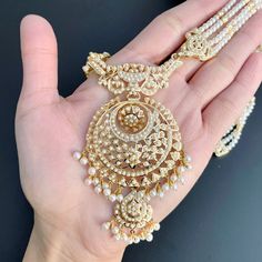 Featured is a classic jadau rani haar in all pearls. The length of the necklace from top to bottom is 12.5 inches. The rani haar necklace is matched with a pair of chandbali earrings. The necklace weighs 66.05 gms including 1.73 gms in hanging pearls and 22.75 gms in the stringing pearls. The earrings weigh 14.95 gms including 1.43 gms in the hanging pearls. Bollywood Chandbali Pearl Necklace For Festive Occasions, Bollywood Style Chandbali Pearl Necklace For Festive Occasions, Bollywood Style Chandbali Pearl Necklace For Festive Season, Diwali Chandbali Pearl Necklace With Intricate Design, Chandbali Pearl Drop Bridal Necklace For Diwali, Chandbali Bridal Necklace With Pearl Drop For Festivals, Traditional Kundan Necklace With Pearl Drop For Reception, Festive Chandbali Pearl Necklace With Intricate Design, Festive Chandbali Pearl Necklace