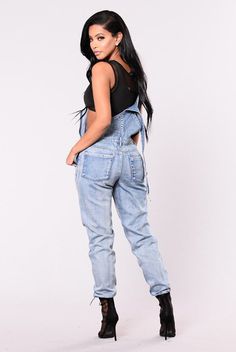 Overalls are back and these destroyed overalls are leading this comeback fashion trend. Made with a a denim blend. These are perfect for a night out paired with a cropped top and and heels or keep it casual in the day with t-shirt and sandals. Denim Jumpsuits And Rompers For Night Out, Trendy High Rise Medium Wash Overalls, Trendy Light Wash Overall Jumpsuits, High Waist Denim Jumpsuit For Streetwear, Trendy High Rise Overalls In Medium Wash, Fitted Denim Jumpsuit For Spring Streetwear, Trendy Light Wash Overall Bottoms, Trendy Light Wash Overalls, Trendy Distressed Jeans For Night Out