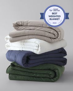 A stack of folded weighted blankets in the colors pebble white, silver sage, and luna blue. [42934587621595, 45574417809627, 42934587818203, 45574417940699, 42934587883739, 46452819001563, 43690188472539, 42934587850971, 46452818444507] Monogram Throw Blanket, Weighted Comforter, Best Weighted Blanket, King Size Blanket, California King Mattress, Queen Blanket, Linen Sheet Sets, Weighted Blankets, Good Nights