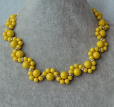 I make the flower necklace to use 6mm and 10mm yellow glass pearls.The necklace length is 16 inches .IT has a 2 inches long adjustable chain, IT is good necklace for your great wedding. I can make different type necklace to your requirements,Please feel free to contact me if you have any question. Thank you so much. . The other matching yellow jewelry: https://www.etsy.com/shop/glasspearlstore/search?search_query=yellow&order=date_desc&view_type=list&ref=shop_search Pearl Flower Necklace, Yellow Flower Necklace, Boho Chic Necklace, Pink Pearl Necklace, Yellow Pearl, Yellow Necklace, Yellow Jewelry, Necklace Wedding, Handmade Beaded Jewelry