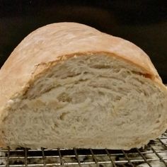 a loaf of bread sitting on top of a metal rack