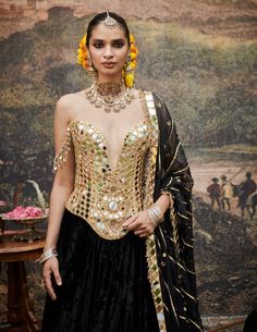 A sophisticated choice, this black linen lehenga features an elegant sprinkling of intricate designs throughout, complemented by stylish gotta stripes on both the lehenga and dupatta. Paired with an exquisite mirror work corset, this ensemble seamlessly blends contemporary elegance with traditional charm, making it perfect for festive occasions and special celebrations. Linen Lehenga, Black Lehenga, Charm Making, Velvet Color, Indian Ethnic Wear, Mirror Work, Black Linen, Intricate Designs, Designer Wear