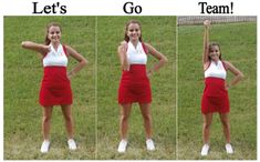 a woman in a red and white dress is standing on the grass with her hands up