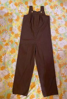 "This listing is for a vintage 1970s pair of chocolate brown overalls. These overalls are so cute an are in very good vintage condition! Overalls are most likely homemade. Material is a medium weight cotton blend. Overalls are a step in style with button shoulder straps. This brown color is the best!  Overalls show little to no wear, nothing to note! Please check measurements for accuracy. Measurements: (please double where appropriate) bust 18\" waist 20\" hips 20 1/2\" inseam 29 1/2\" straps 1 Brown Overalls, Womens Overalls, Cotton Overalls, Bohemian Hippie, Overalls Women, Hippie Bohemian, Vintage 1970s, Boho Bohemian, Chocolate Brown