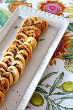 a white plate topped with lots of pastry