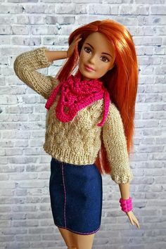 a doll with red hair wearing a sweater and skirt