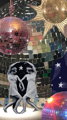 two women are dancing in front of disco balls and star shaped mirrors on the wall