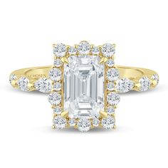 an emerald cut diamond surrounded by diamonds in yellow gold