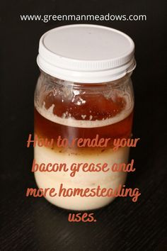 a jar filled with liquid sitting on top of a wooden table next to a black background