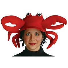 a woman wearing a red crab hat with googly eyes