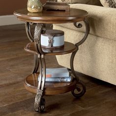 a living room with a couch, table and lamp on top of the coffee table