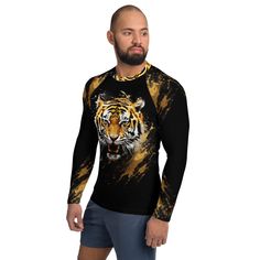 Don't let sunburn, wind, sand, or other elements ruin your day! This Men's Smooth & Versatile Rash Guard Activewear Shirt with a Unique Tiger Design will protect you while you have fun doing sports. It is slim-fitted with flat ergonomic seams, and a bit longer than your casual tee for extra comfort and protection. * 82% polyester, 18% spandex * Very soft four-way stretch fabric that stretches and recovers on the cross and lengthwise grains * UPF 50+ * Comfortable longer body and sleeves * Flat seam and coverstitch Refer to Sizing Chart above in Photo Section Long Sleeve Sports Shirt For Summer, Long Sleeve Shirt For Summer Sports, Moisture-wicking Crew Neck Top For Water Sports, Yellow Sports Shirt For Summer, Yellow Summer Sports Shirt, Sporty Black Tops For Water Sports, Weightlifting Shirts, Flat Seam, Unique Beach