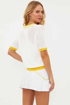 The Giana Top is our retro-inspired short-sleeved collared shirt with a breathable, open-knit design. Featuring a contrast rib knit spread collar, hem, cuffs, and dropped shoulders. This top is perfect for the court and beyond. 100% COTTON Model is wearing size small Jumpsuit And Blazer, Pickle Ball, Top Game, Beach Tops, Mother Denim, Sweater Sale, Romper Dress, White Sand, Collared Shirt