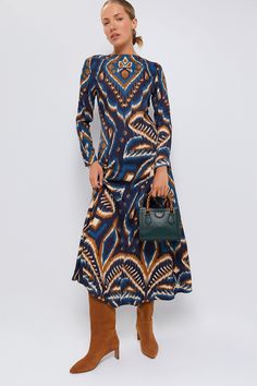 A captivating patterned maxiThis chic style boasts an eye-catching ikat pattern in hues of blue and orange, adorning a sleek relaxed silhouette that gracefully frames your body. We are styling this with a belt and boots for autumnal gatherings, or with heels and a clutch for wedding festivities.Our Favorite Details: Back zip closure Gussets at skirt Soft fabric Material: 100% ViscoseCare: Machine wash gentle cycle, line dryAbout the BrandFarm Rio is a carbon-neutral clothing and lifestyle brand Luxury Ikat Print Festive Dresses, Fitted Ikat Print Dress, Blue Cotton Ikat Print Dress, Festive Ikat Print Long Sleeve Dress, Spring V-neck Ikat Print Dress, Neutral Clothing, Green Bamboo, Blue Maxi Dress, Wedding Festivities