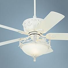 a white ceiling fan with a light on it