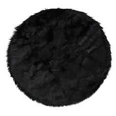 a round black fur rug on a white background