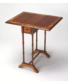 a small wooden table with two drawers on one side and an open drawer on the other