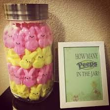 a jar filled with peeps next to a framed photo